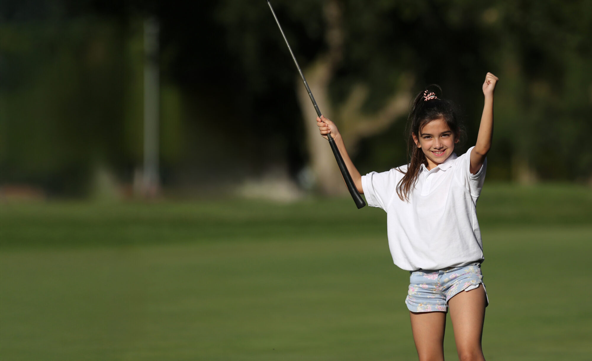 Youth celebrating golf