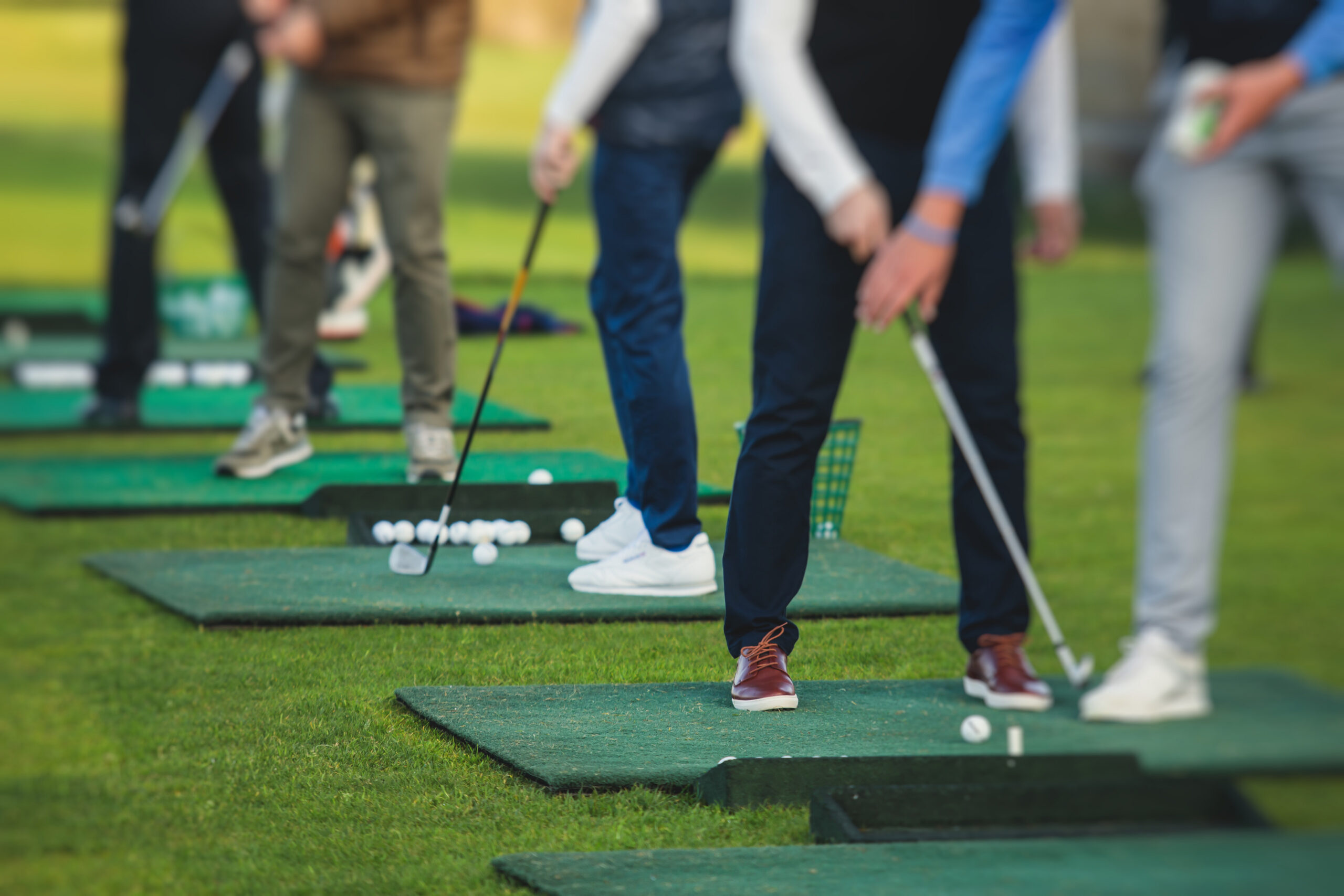 Golfers at driving range